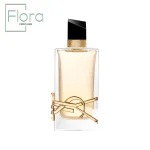 این تصویر یک بطری عطر شیک از برند ایو سن لورن (Yves Saint Laurent) را نمایش میدهد. بطری شفاف است و مایع طلایی رنگ داخل آن به زیبایی دیده میشود. درب بطری به رنگ مشکی با طراحی هندسی و ظریف است و یک نوار طلایی تزئینی در گردنه ظرف دیده میشود. لوگوی طلایی YSL به صورت برجسته روی بطری قرار گرفته و جلوهای لوکس به آن بخشیده است.